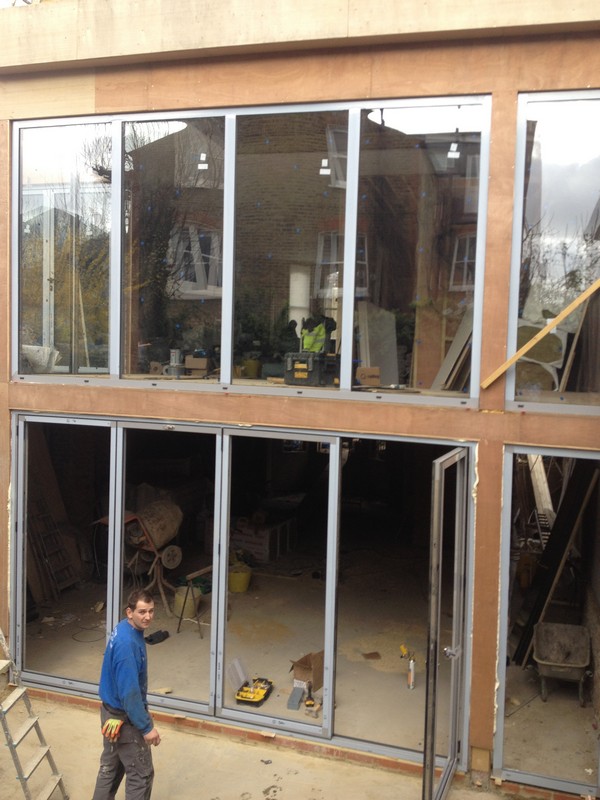 Aluminium bi-fold doors with two-storey glazing in Rotherhithe