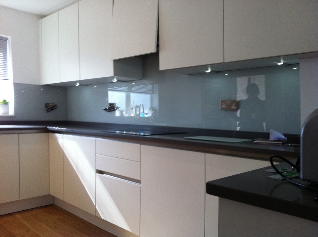 Grey glass kitchen splashback with LED lighting in Rotherhithe
