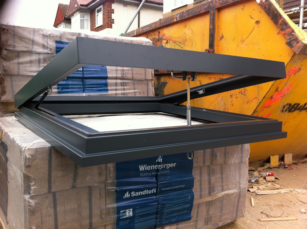 Opening flat roof skylight in anthracite grey installed in Rotherhithe