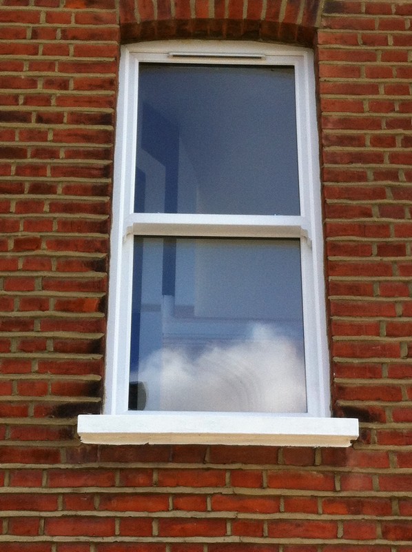 uPVC sash window on Victorian red brick house in Rotherhithe